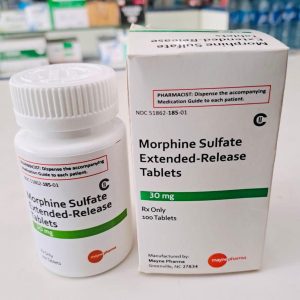 Authentic morphine sulfate oral tablets in secure pharmaceutical blister packaging on a white surface.