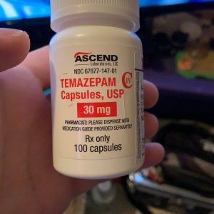 Authentic Restoril temazepam capsules in original pharmacy packaging on a clean background