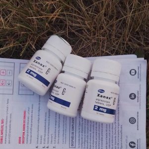 Authentic Xanax alprazolam tablets in original pharmaceutical blister packaging on a clean surface.