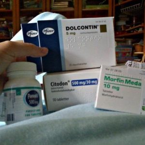 Labeled box of authentic Dolcontin morphine continuous-release tablets on a clean pharmacy counter.