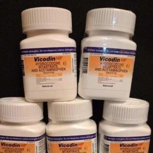Labeled pharmaceutical bottle of authentic hydrocodone acetaminophen tablets on a clean counter.